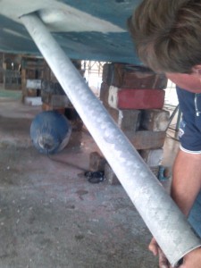 Sliding the new fiberglass stern tube into the hull prior to scoping